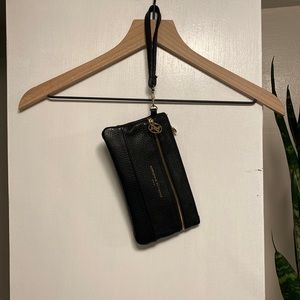 Adrienne Vittadini black leather clutch with gold hardware